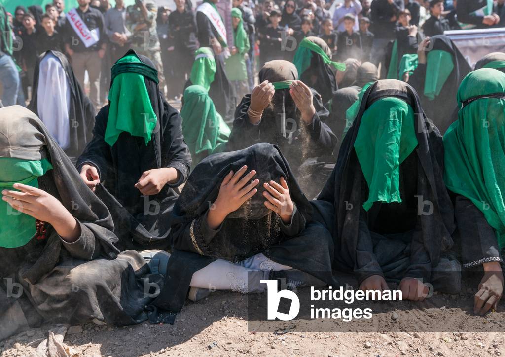 Shiite women crying during a traditional religious theatre called tazieh about Imam Hussein death in Kerbala, Lorestan Province, Khorramabad, Iran (photo)