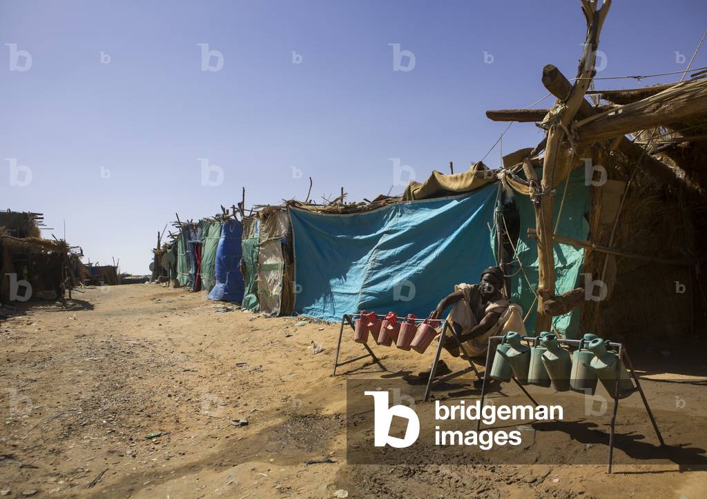 Man Doing Ablutions in The Street, Alkhanag, Khartoum State, Sudan (photo)