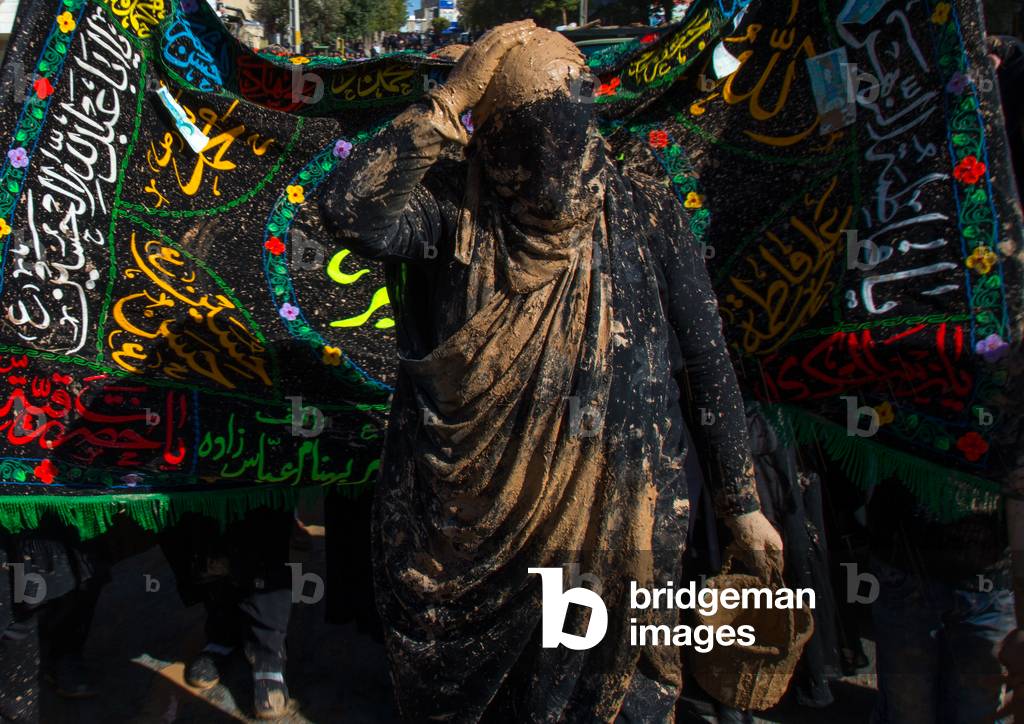 Iranian Shiite Muslim Woman Putting Mud on her Head during Ashura, Kurdistan Province, Bijar, Iran (photo)