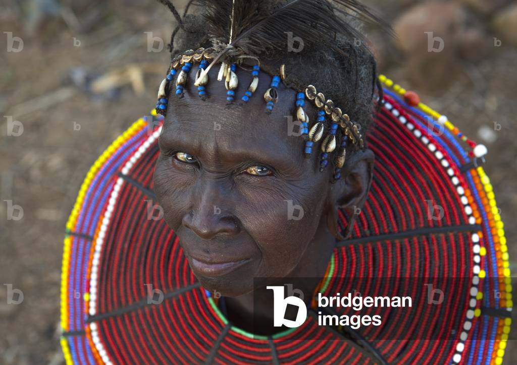 A pokot woman wears large necklaces made from the stems of sedge grass, Baringo county, Baringo, Kenya, Africa (photo)