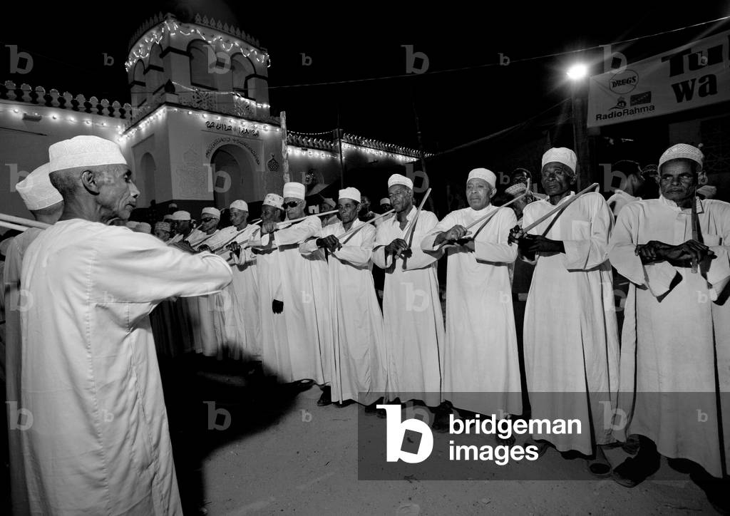 Men dancing goma stick dance at maulidi festival, Lamu, Kenya, Africa (photo)