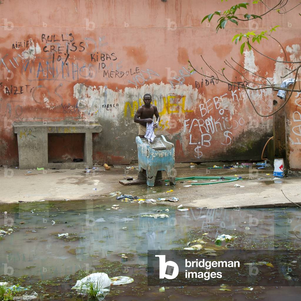 Man Doing his Laundrey in the Courtyard of the Former Grande Hotel, Now a Squat, Luanda, Angola, Africa (photo)