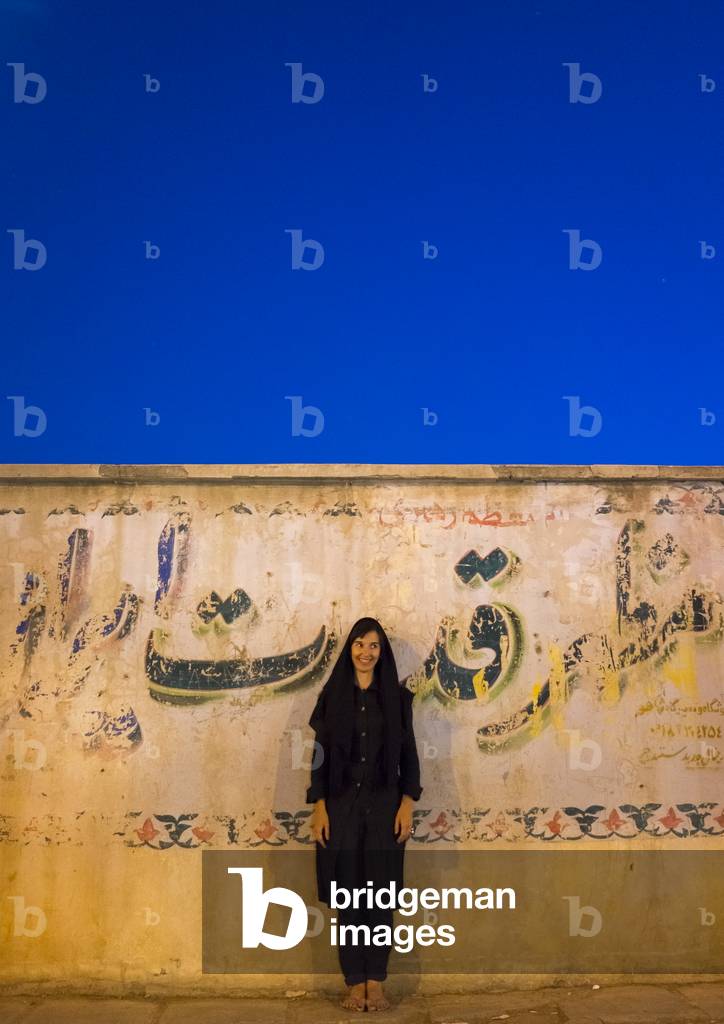 Woman Standing In Front A Wall, Marivan, Iran, 2013 (photo)