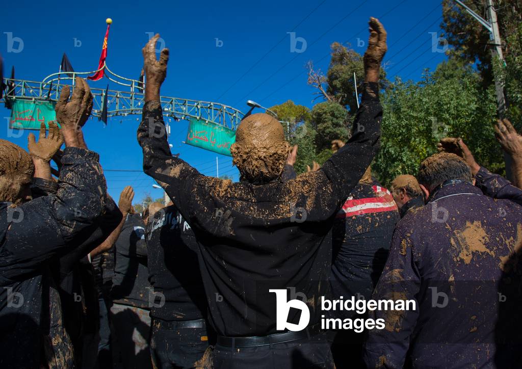 Iranian Shiite Muslim Men Covered in Mud, Chanting and Self-flagellating during Ashura, Kurdistan Province, Bijar, Iran (photo)