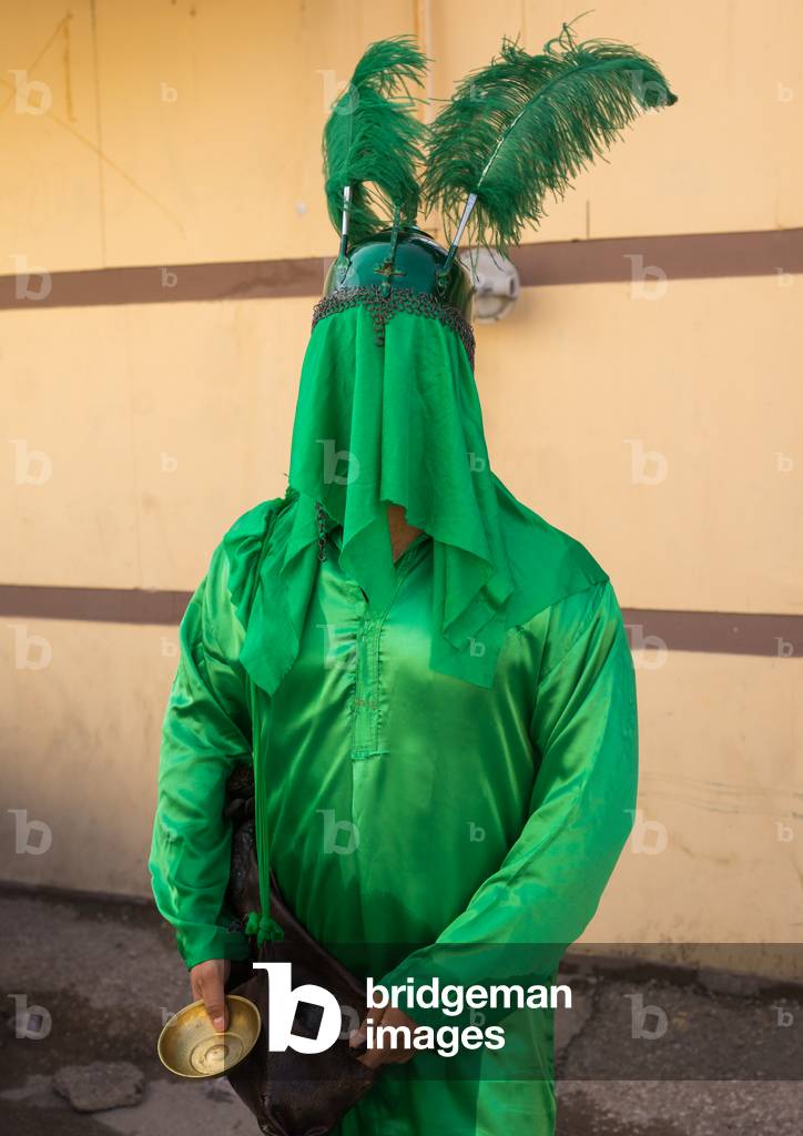Iranian Man with Green Historic Costume during Chehel Menbari Festival on Tasua Day, Lorestan Province, Khorramabad, Iran (photo)