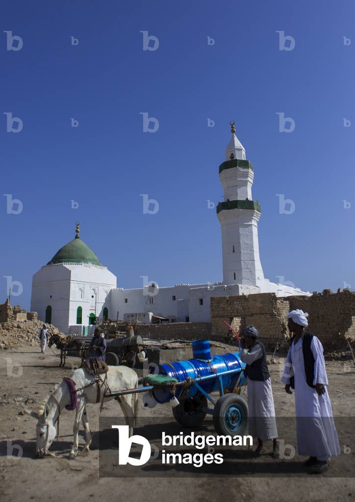 Man with a Cart And a Donkey in Front of Taj Es-Sir Mosque on Mainland El-Geyf, Suakin, Port Sudan, Sudan (photo)