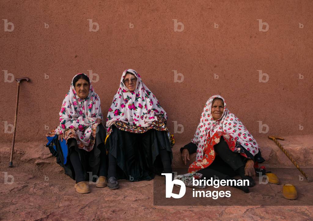 Portrait of Iranian Women wearing Traditional Floreal Chadors in Zoroastrian Village, Isfahan Province, Abyaneh, Iran (photo)