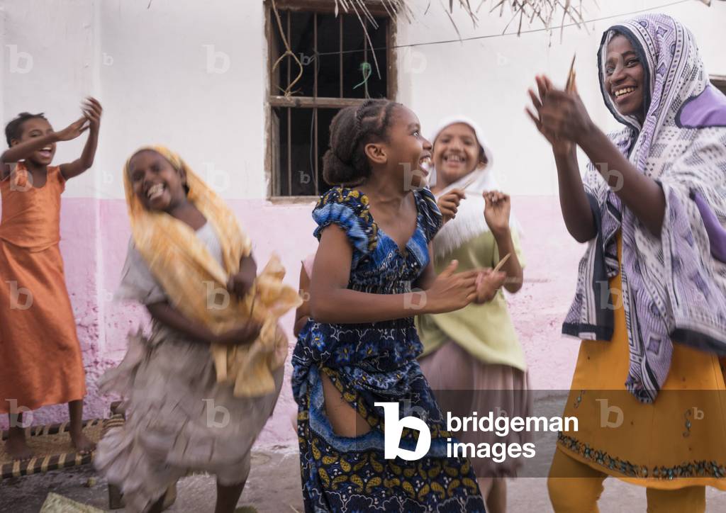 Girls dancing and singing in a courtyard, Lamu county, Matondoni, Kenya, Africa (photo)
