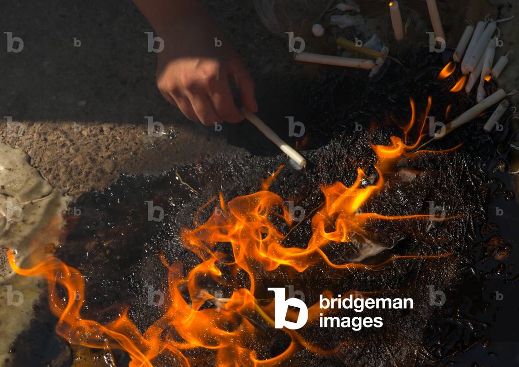 Iranian Women Light Candles during Chehel Menbari Festival on Tasua to Commemorate the Martyrdom Anniversary of Hussein, Lorestan Province, Khorramabad, Iran (photo)
