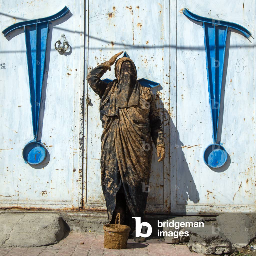 Iranian Shiite Muslim Woman Covered in Mud, Chanting and Self-flagellating during Ashura, Kurdistan Province, Bijar, Iran (photo)