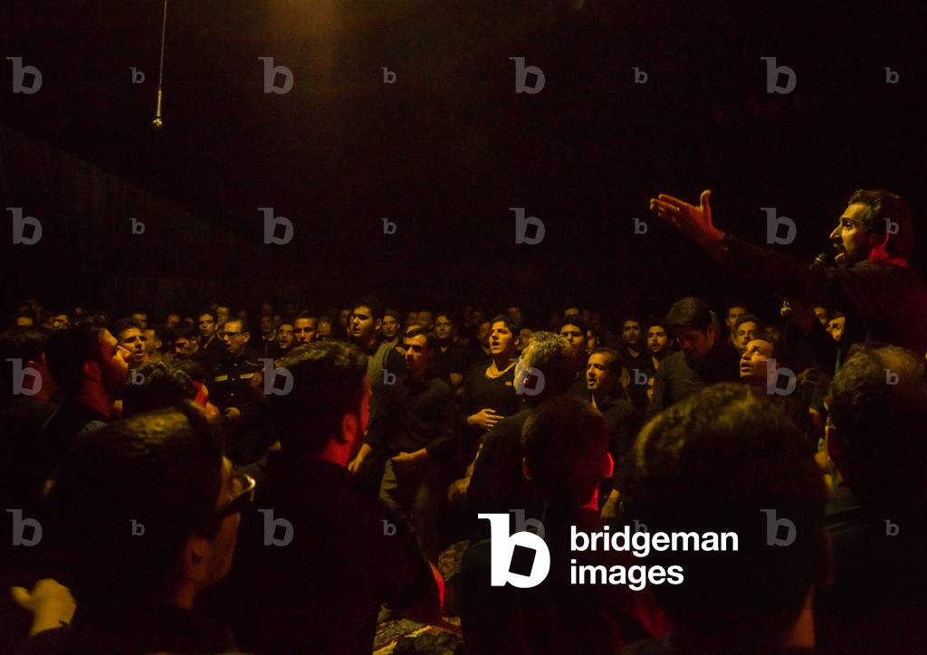 Iranian Shiite Muslim Men in a Mosque Chanting and Self-flagellating during Ashura, Isfahan Province, Kashan, Iran (photo)