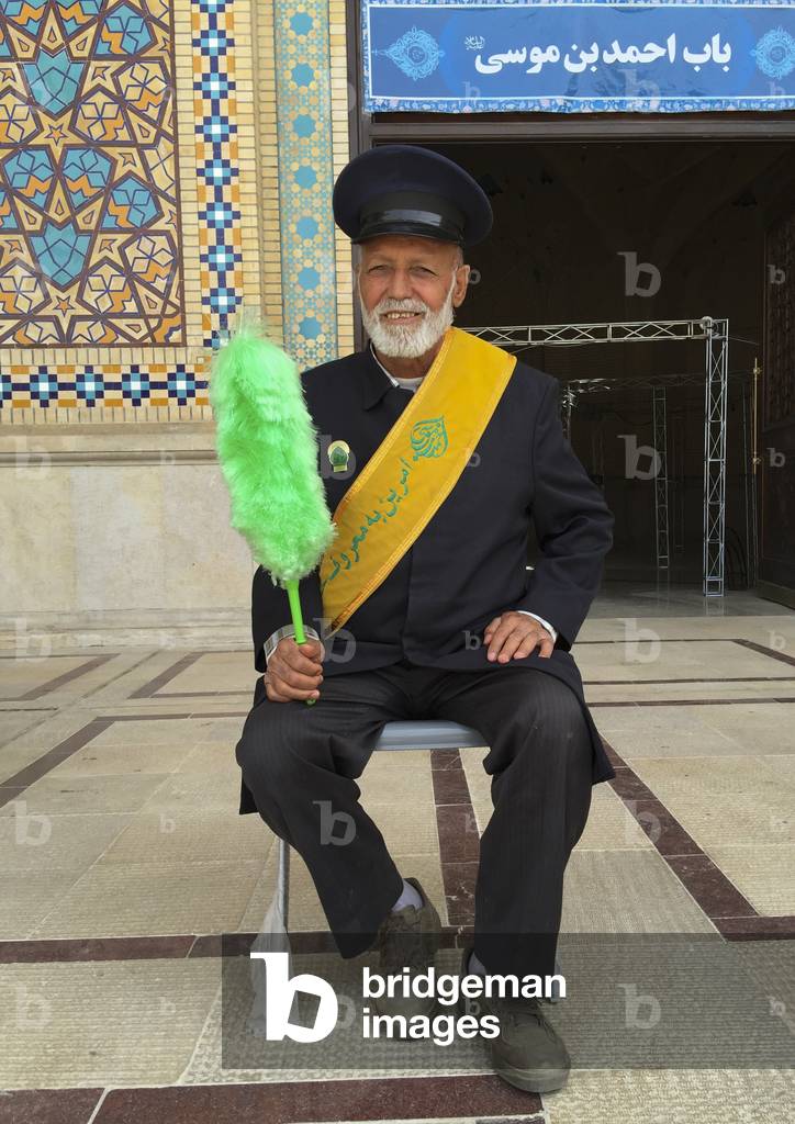 Guard With A Green Feather Duster At The Shah-E-Cheragh Mausoleum, Fars Province, Shiraz, Iran, 2015 (photo)
