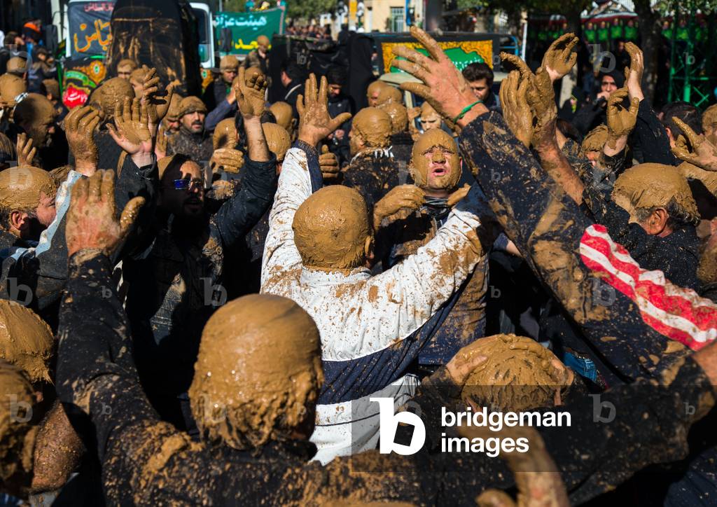 Iranian Shiite Muslim Men Covered in Mud, Chanting and Self-flagellating during Ashura, Kurdistan Province, Bijar, Iran (photo)