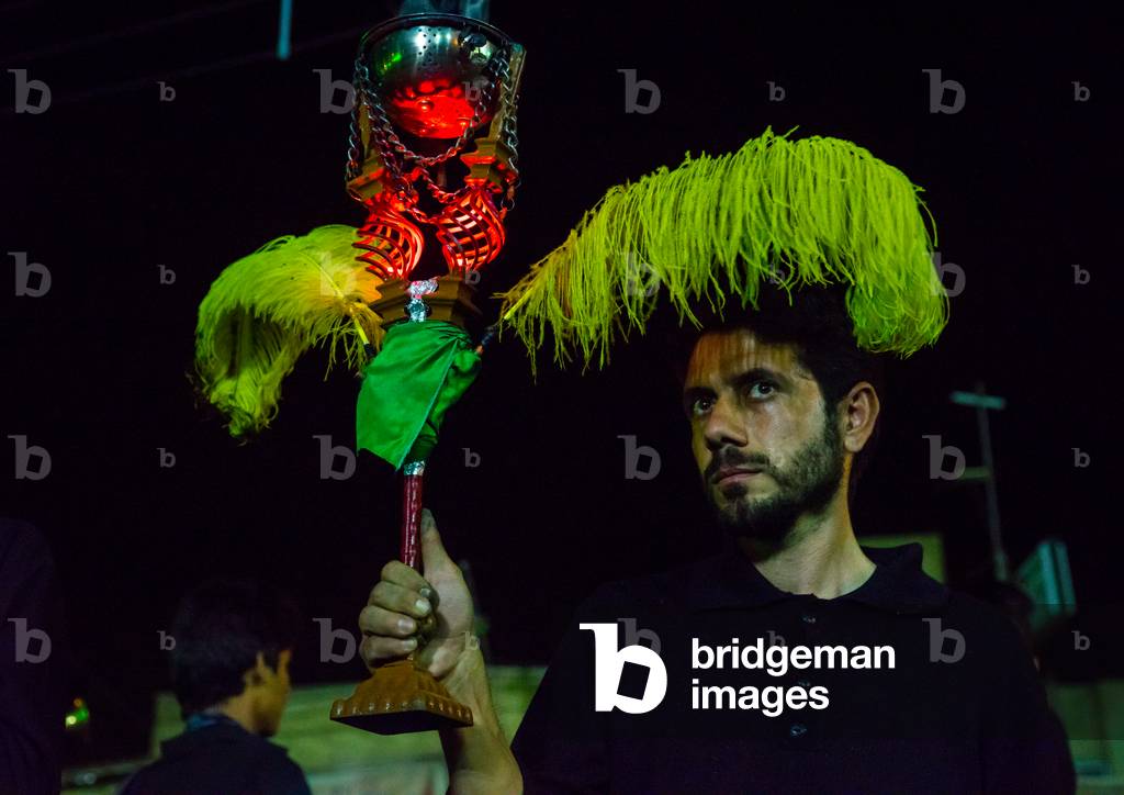 Iranian Shiite Muslim Man Holding an Incense Burner during Ashura, Isfahan Province, Kashan, Iran (photo)