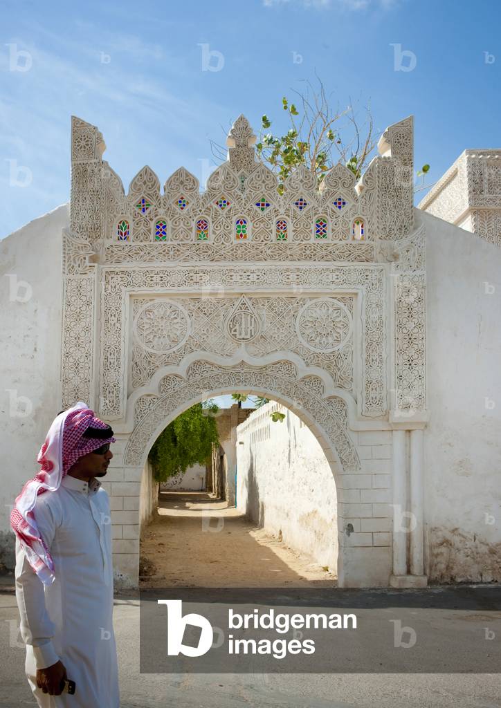 Saudi Man in Front of An Ottoman Old Gate, Farasan Island, Jizan Province, Saudi Arabia (photo)