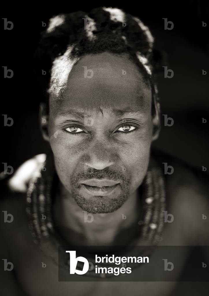 Himba Man with Traditional Hairstyle, Angola, Africa (b/w photo)