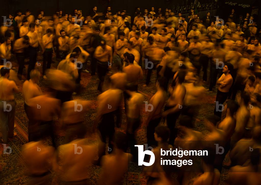 Iranian Shiite Muslim Mourners From the Mad of Hussein Community Chanting and Self-flagellating in Circle during Muharram, Isfahan Province, Kashan, Iran (photo)