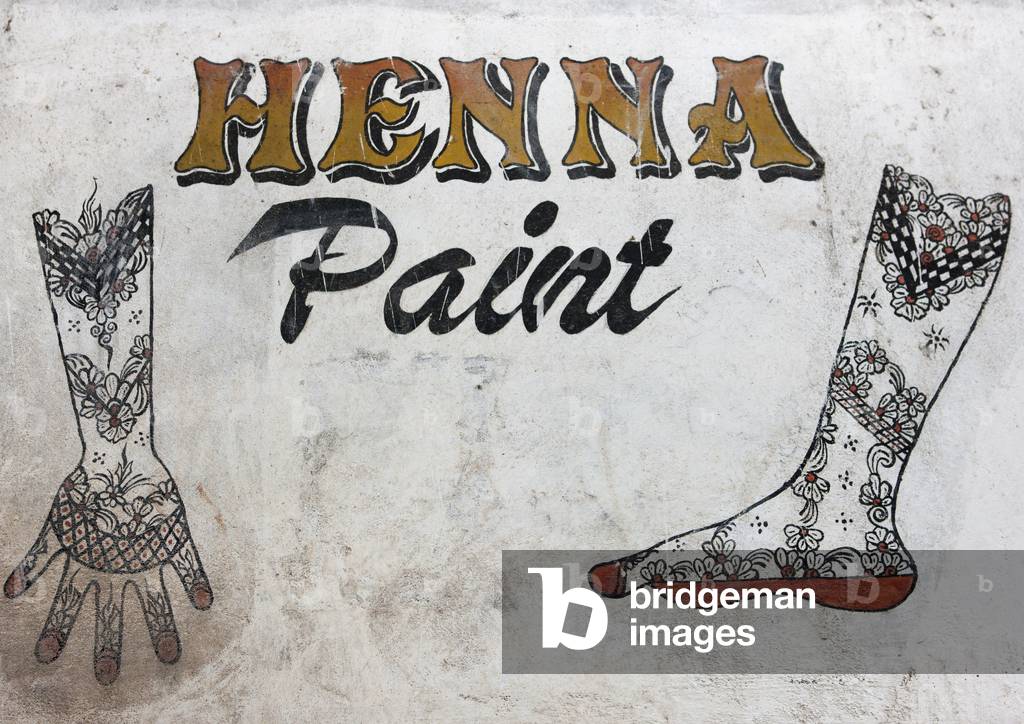 Henna paint sign painted on a wall, Lamu, Kenya, Africa (photo)