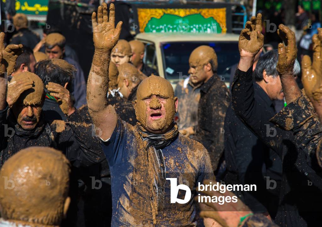 Iranian Shiite Muslim Men Covered in Mud, Chanting and Self-flagellating during Ashura, Kurdistan Province, Bijar, Iran (photo)