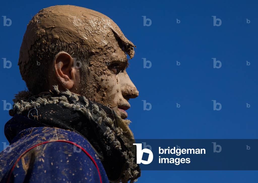 Iranian Shiite Muslim Man Covered in Mud during Ashura Day, Kurdistan Province, Bijar, Iran (photo)