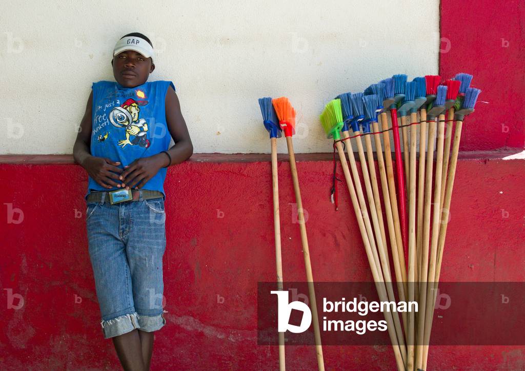 Young Man selling Brooms in Namibe Town, Angola, Africa (photo)