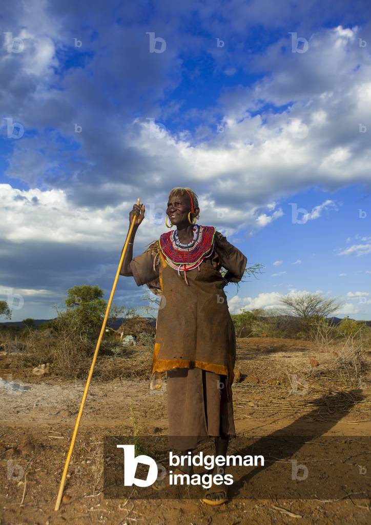 A pokot woman wears large necklaces made from the stems of sedge grass, Baringo county, Baringo, Kenya, Africa (photo)