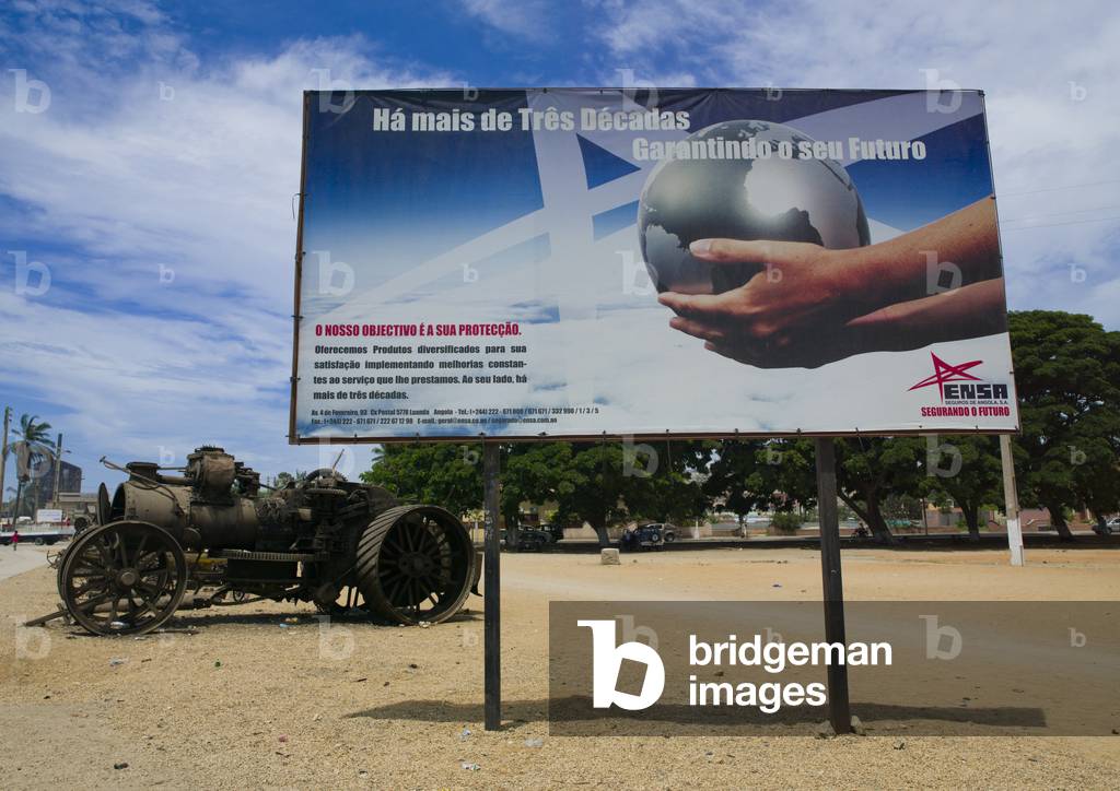 Tractor Wreck Behind a Hoarding in Lobito, Angola, Africa (photo)