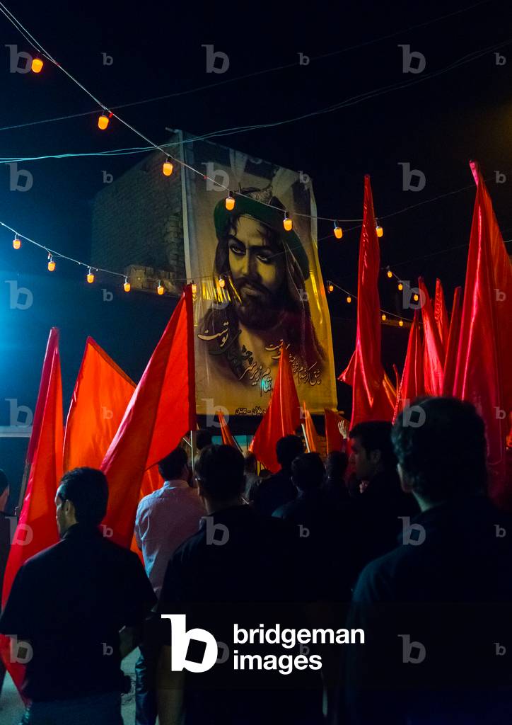 Iranian Shiite Muslims Men Parading with Red Flags during Ashura, Isfahan Province, Kashan, Iran (photo)