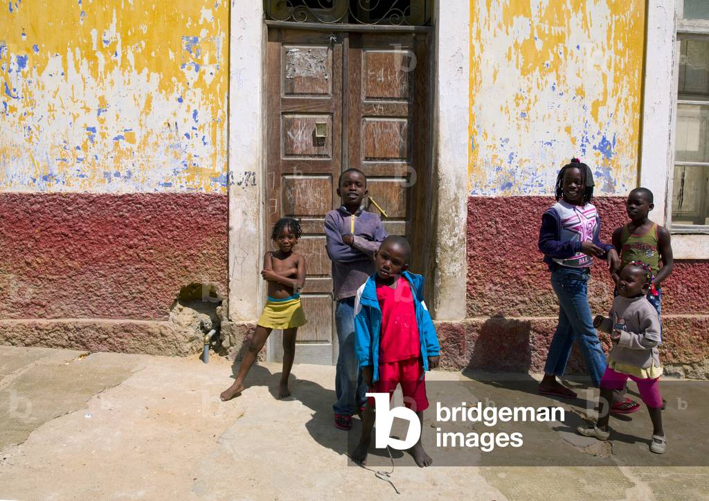 Kids in front of Dilapidated House in Namibe Town, Angola, Africa (photo)