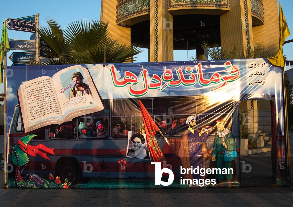 Picture of bus depicting Iranian soldiers going to the iraqi front in the Rose garden of martyrs cemetery, Isfahan Province, Isfahan, Iran (photo)