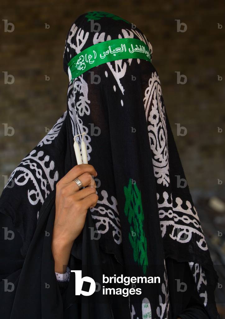 Iranian Shiite Muslim Woman mourning Imam Hussein on the Day of Tasua with her Face Covered by a Veil, Lorestan Province, Khorramabad, Iran (photo)