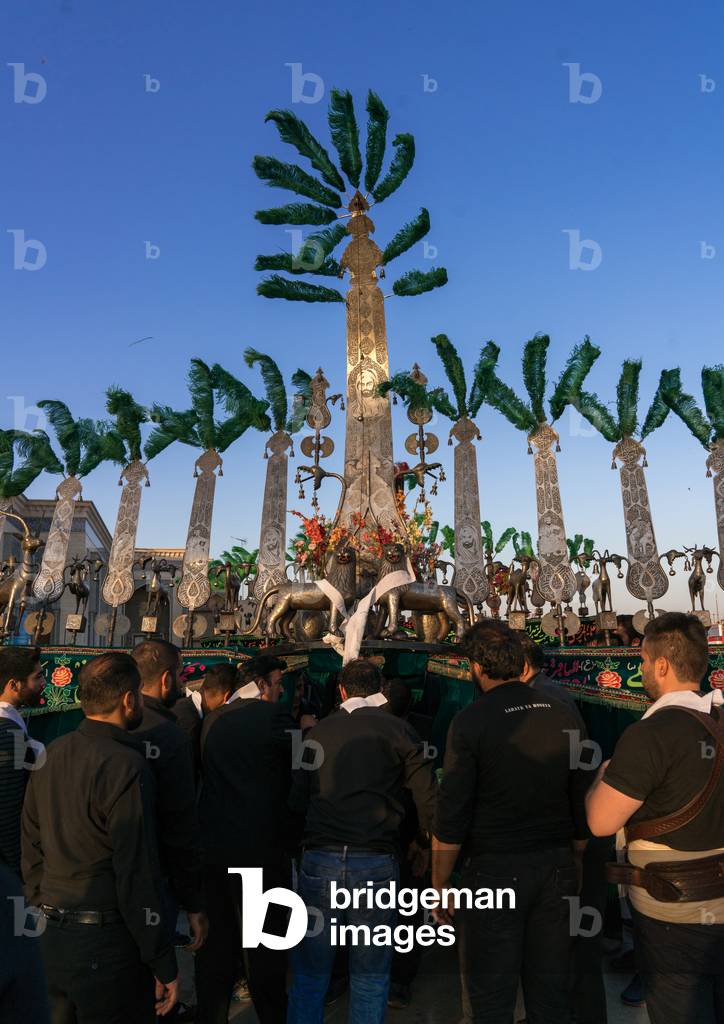 Alam procession during Muharram celebrations in Fatima al-Masumeh shrine, Central County, Qom, Iran (photo)