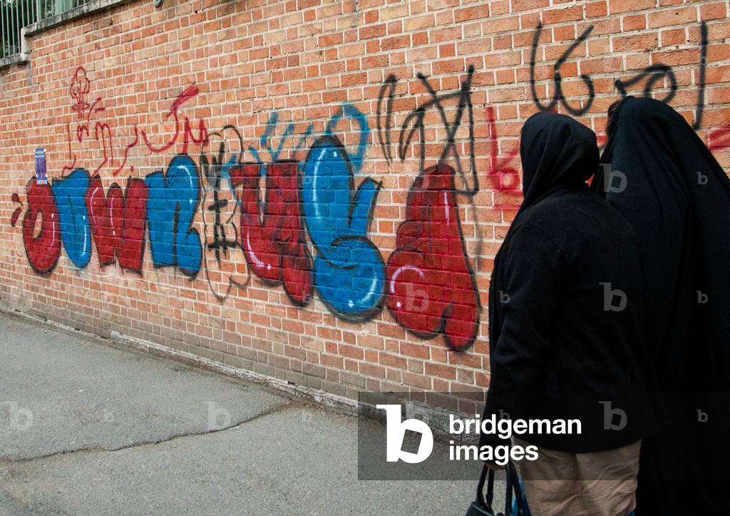 Anti-american mural propaganda on the wall of the former United States Embassy saying down with usa, Central district, Tehran, Iran (photo)