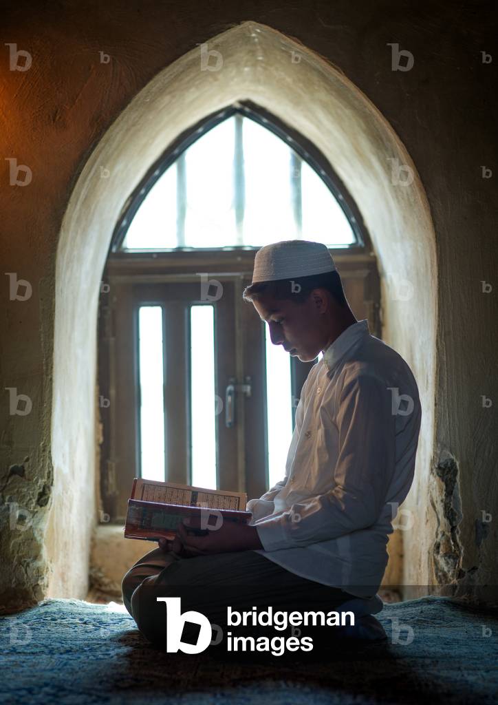 Iranian Shiite Muslim Student Reading the Koran in a Madrassah, Golestan Province, Karim Ishan, Iran (photo)