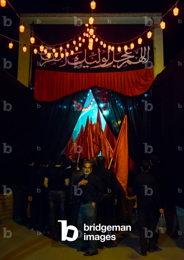 Iranian Shiite Muslims Men Parading with Red Flags during Ashura, Isfahan Province, Kashan, Iran (photo)