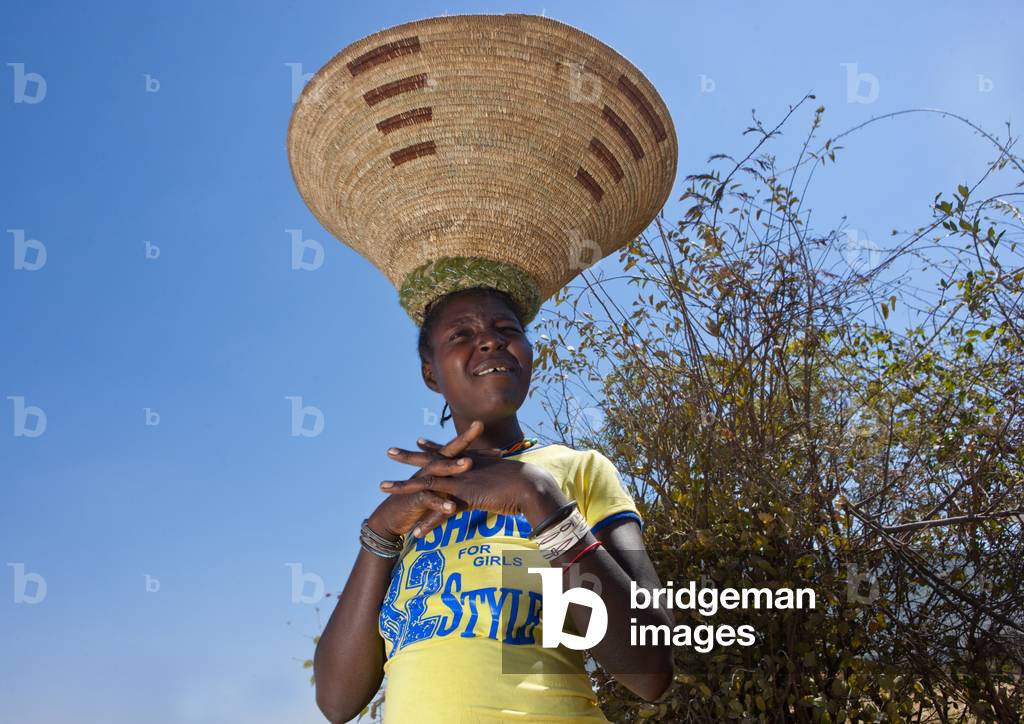 Mumuhuila Woman Wearing a Western Tee Shirt, Hale Village, Angola, Africa (photo)