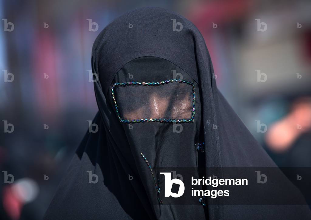 Iranian Shiite Muslim Woman mourning Imam Hussein on the Day of Tasua with her Face Covered by a Veil, Lorestan Province, Khorramabad, Iran (photo)