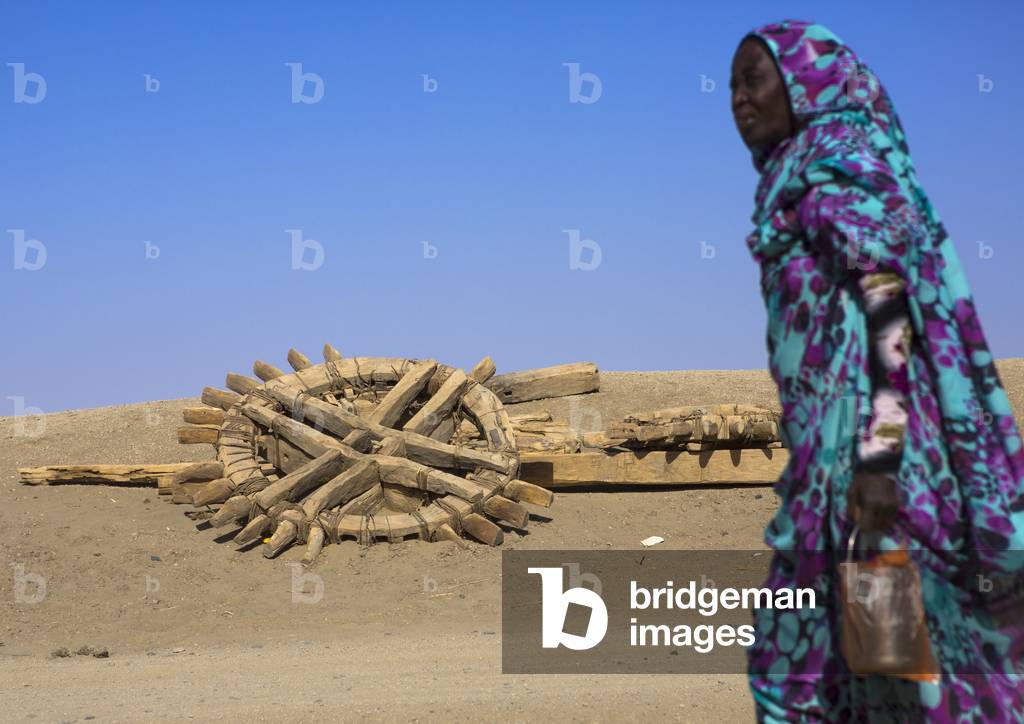 Nubian Woman Passing in Front of An Old Well, Delgo, Northern Province, Sudan (photo)