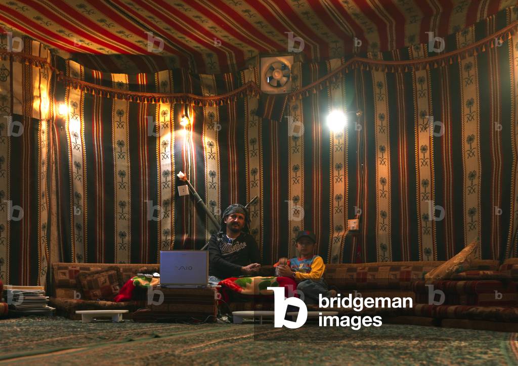 Father And Son Inside a Tent Built Inside a Modern House, Al Fifa, Jazan, Saudi Arabia (photo)