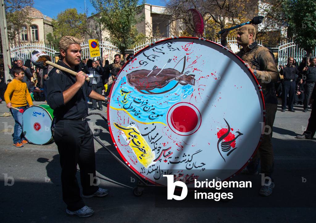 Drummer of the Shiite Ashura Procession, Kurdistan Province, Bijar, Iran (photo)