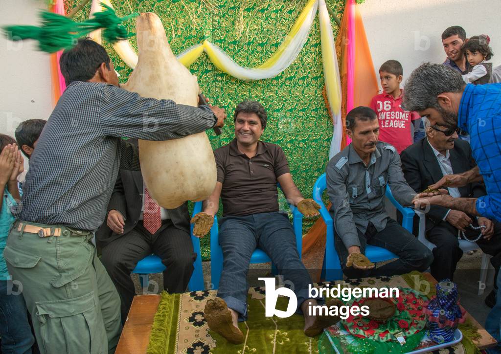Men Playing Sheep Skin Pipe Bag For The Groom During A Wedding Ceremony, Hormozgan, Kushkenar, Iran, 2015 (photo)