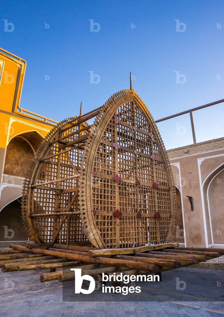 A Wooden Nakhl in front of the Three-storey Hosseinieh, Yazd Province, Yazd, Iran (photo)