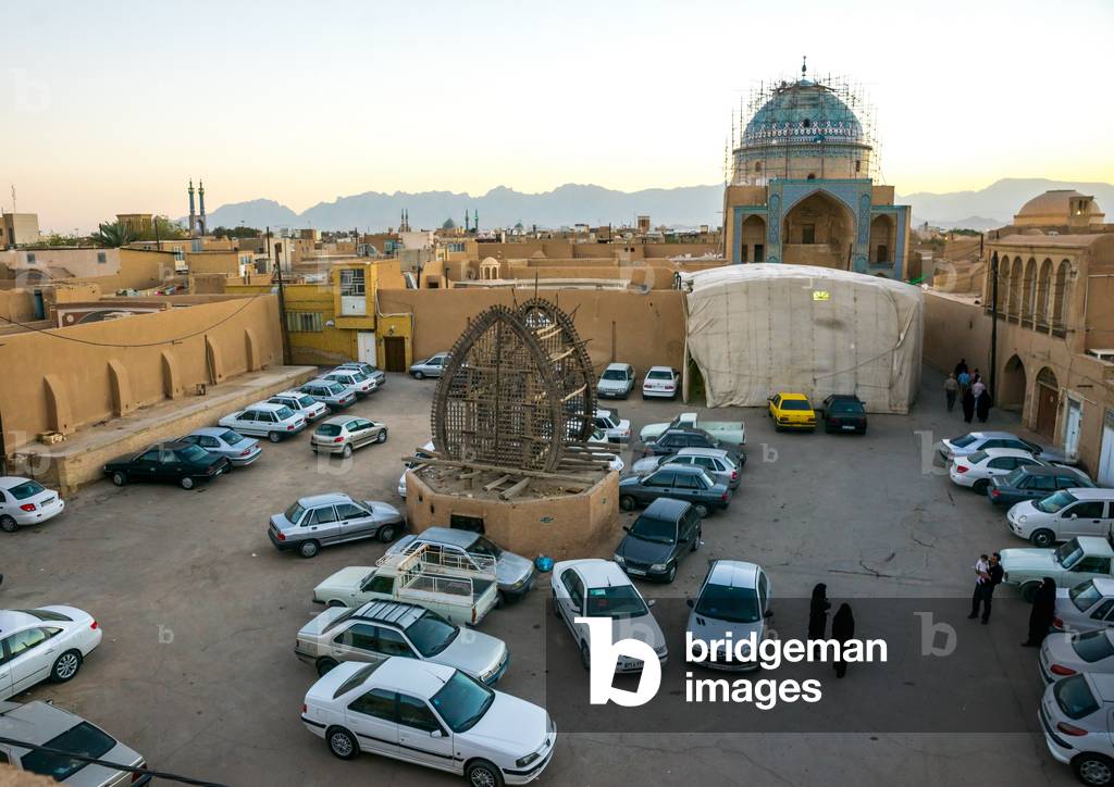 A Wooden Nakhl on a Square Filled with Cars, Yazd Province, Yazd, Iran (photo)