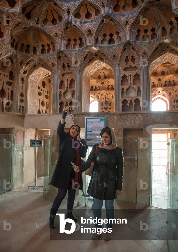 Iranian Women Taking Selfie Picture In The Acoustic Ceiling In The Music Room Of Ali Qapu Palace, Isfahan Province, Isfahan, Iran, 2016 (photo)