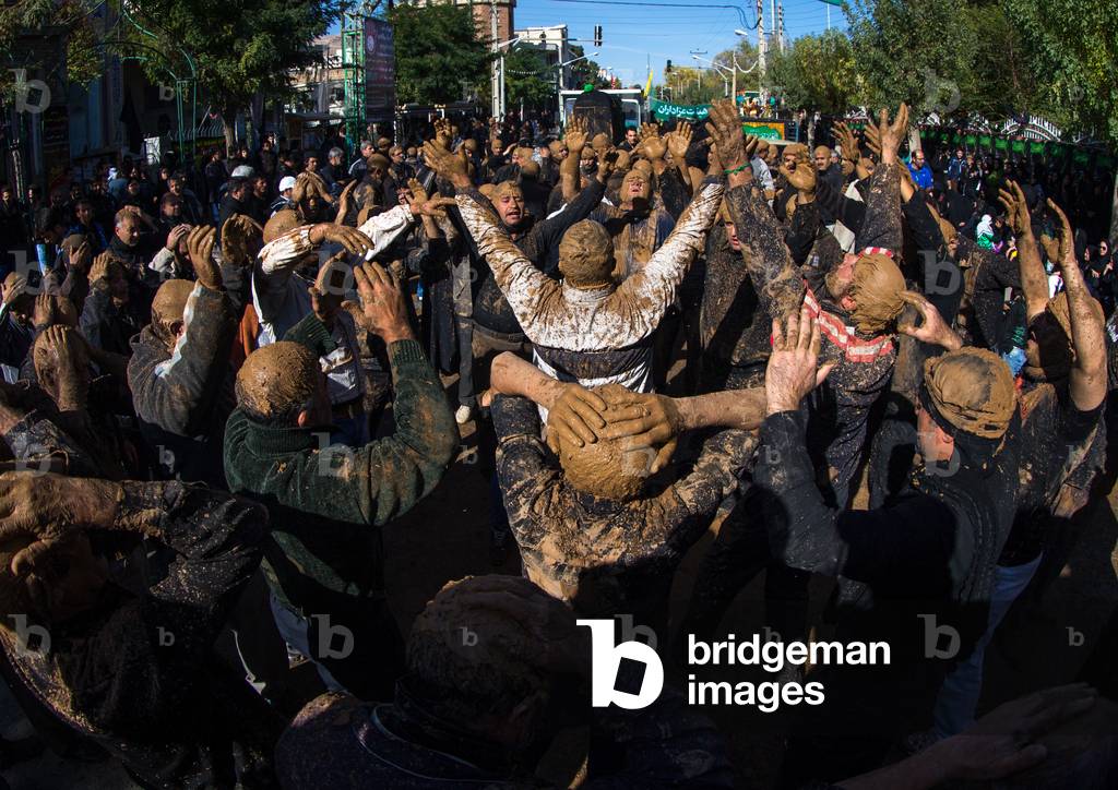 Iranian Shiite Muslim Men Covered in Mud, Chanting and Self-flagellating during Ashura, Kurdistan Province, Bijar, Iran (photo)