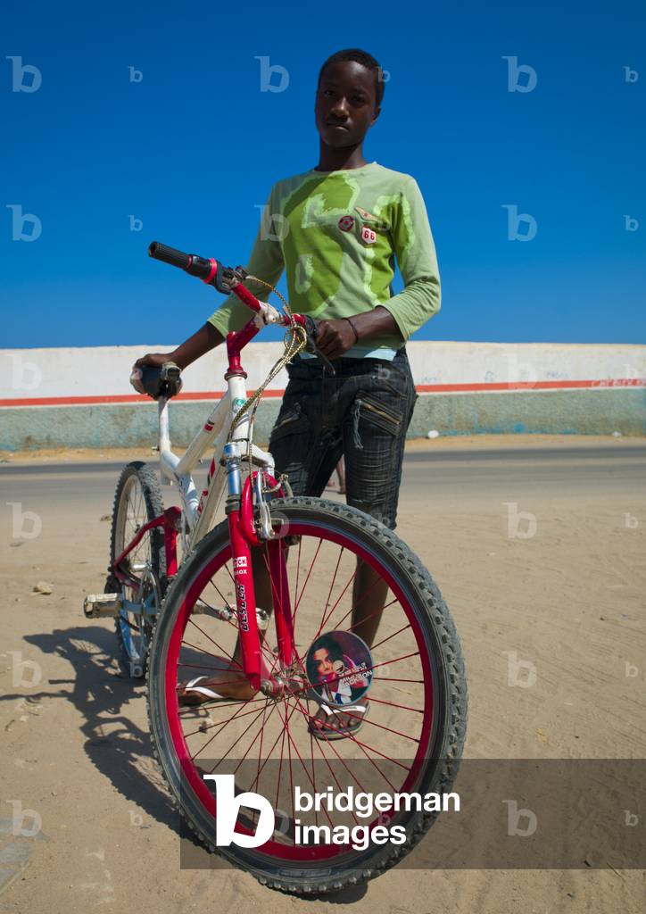 Young Man with his Bike, Namibe Town, Angola, Africa (photo)