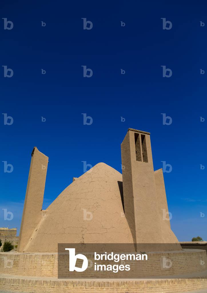Wind towers used as a natural cooling system for water reservoir in Iranian traditional architecture, Yazd Province, Meybod, Iran (photo)