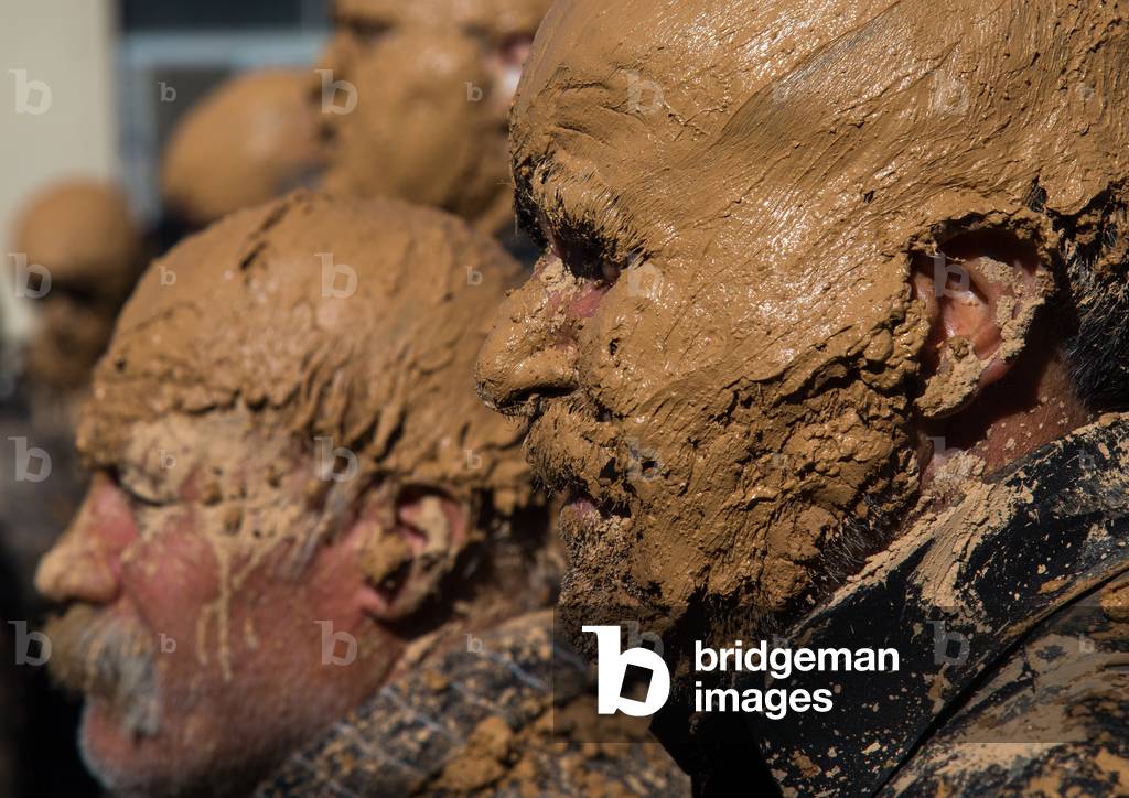 Iranian Shiite Muslim Men Covered in Mud during Ashura Day, Kurdistan Province, Bijar, Iran (photo)