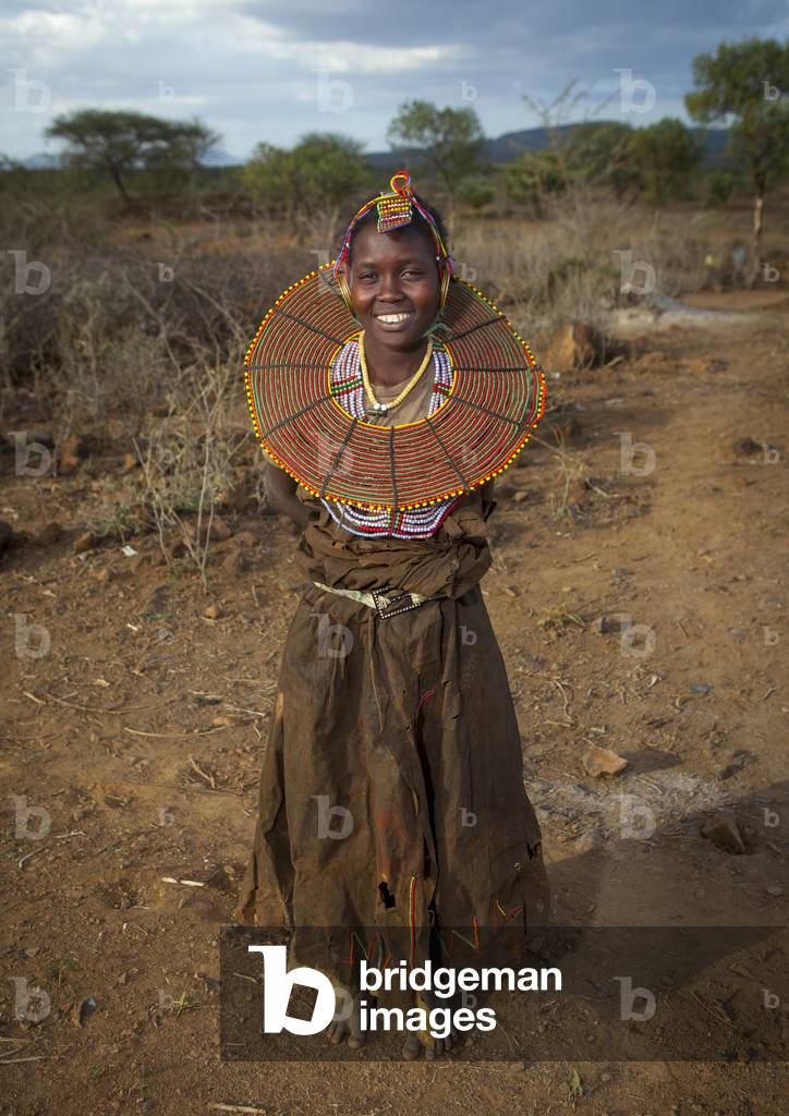 A pokot woman wears large necklaces made from the stems of sedge grass, Baringo county, Baringo, Kenya, Africa (photo)