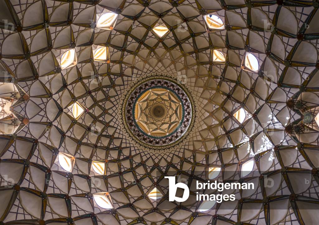 Ceiling with its intricate and elaborate patterns and internal stainless glass dome the Boroujerdi house, Isfahan province, Kashan, Iran (photo)